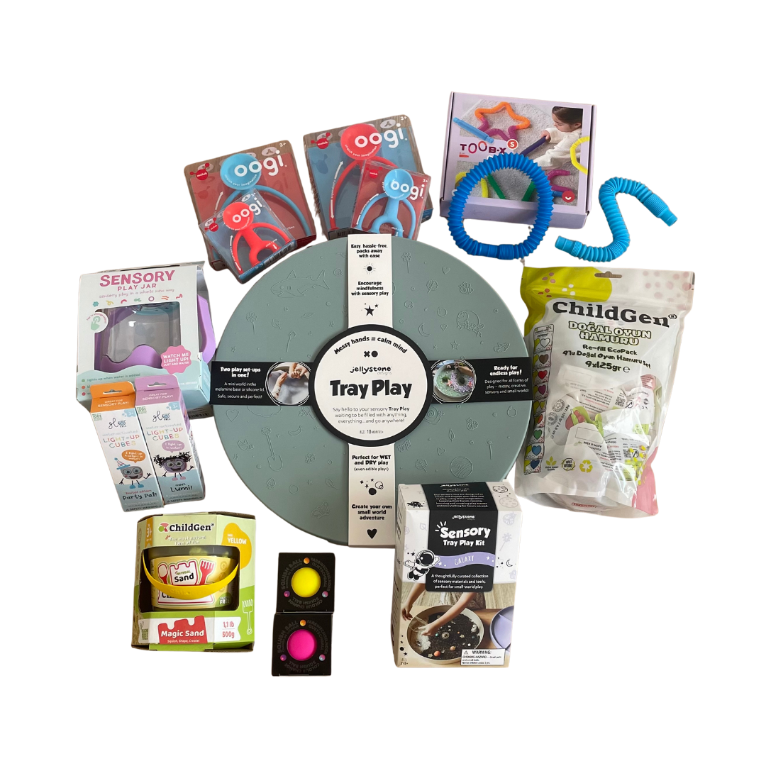 Kit Sensorial Kiboo con bandeja, jarra Glo Pals, arena kinética, OOGI, plastilina, pelotas sensoriales y tubos TOOB-X para juego multisensorial.